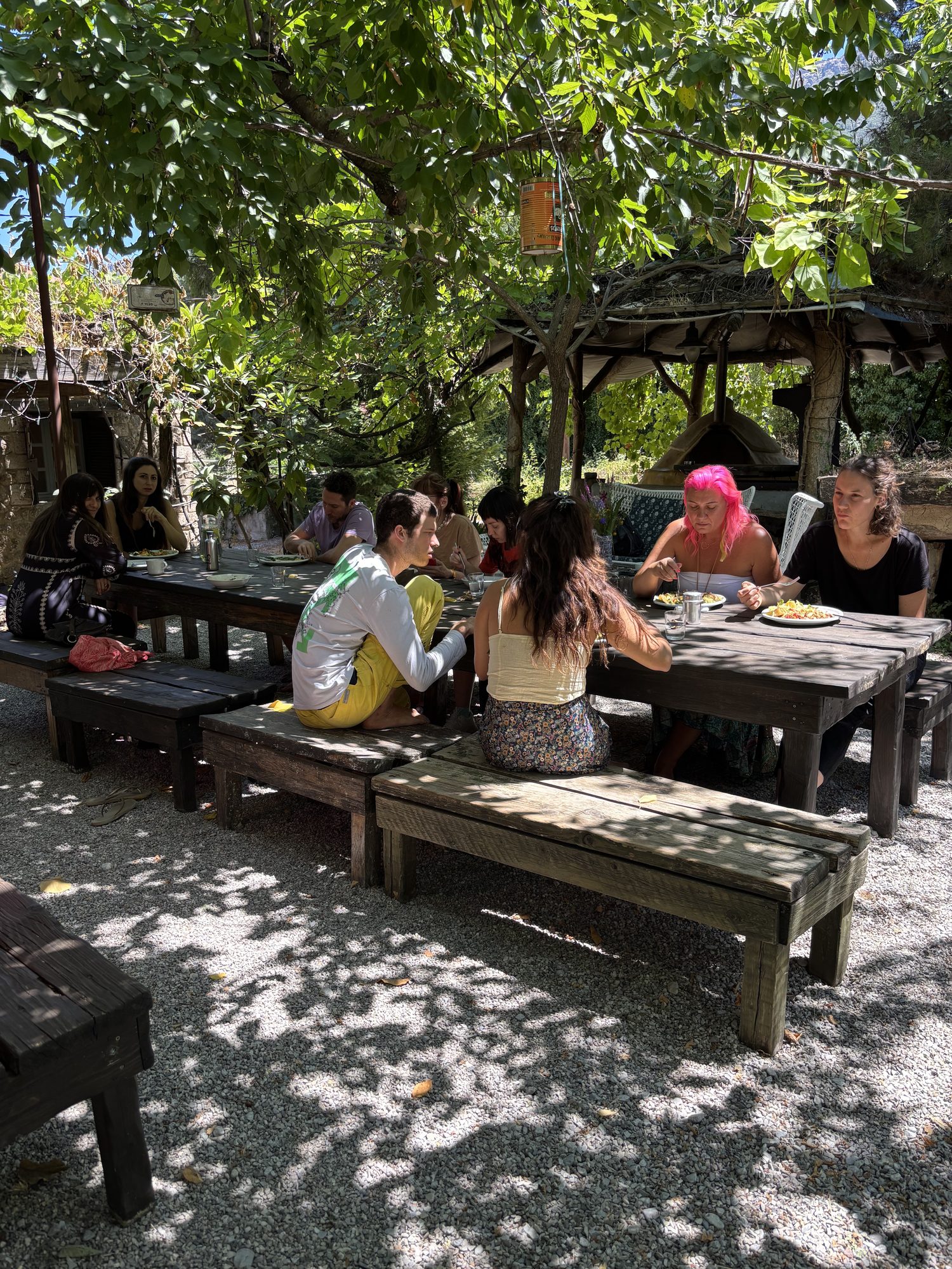The group eating together outdoors